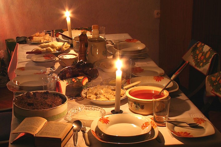 Candle-lit dinner table with food