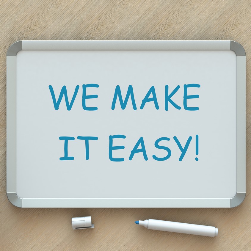 WE MAKE IT EASY!, message on whiteboard, smart phone and coffee on table