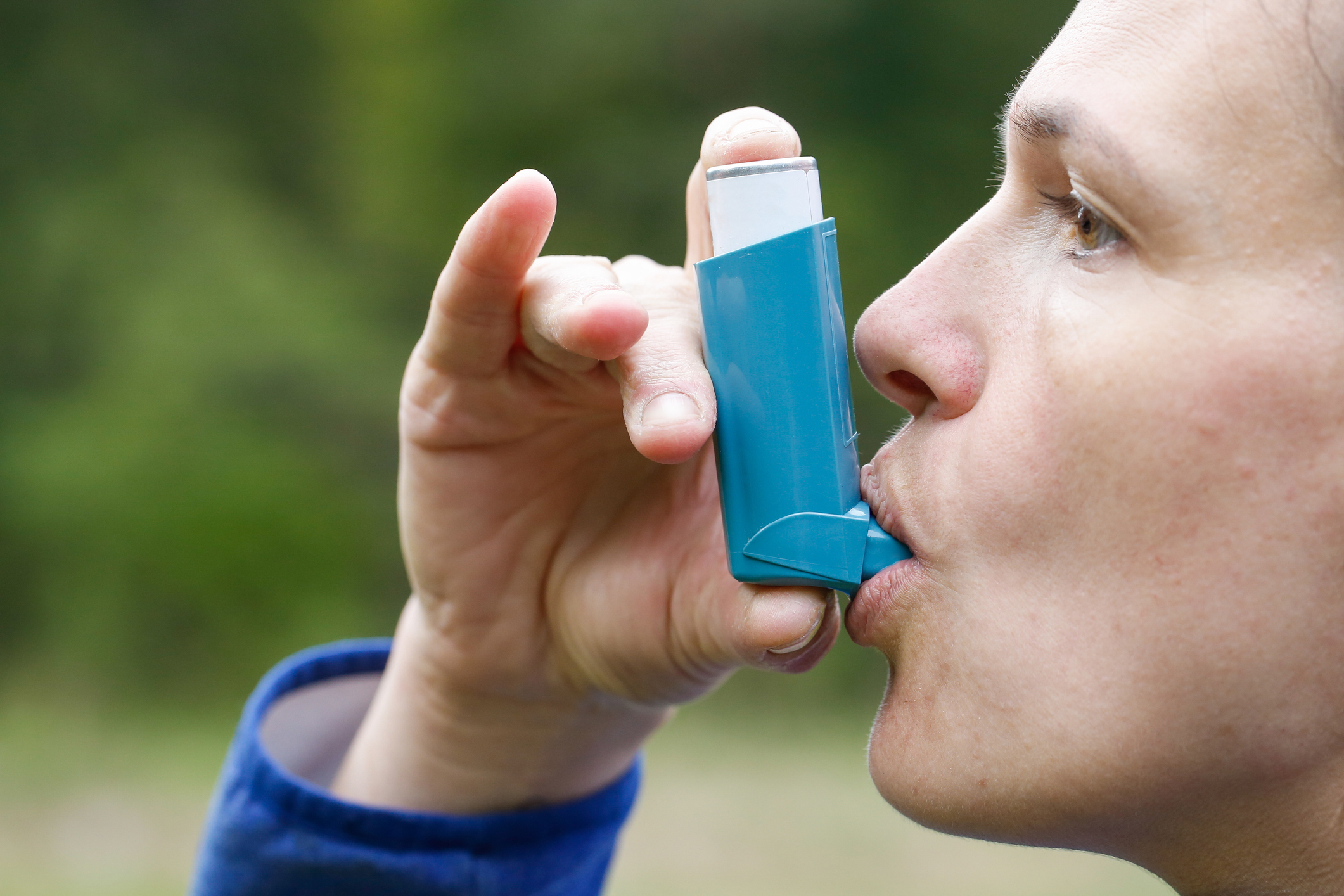 Asthma patient inhaling medication