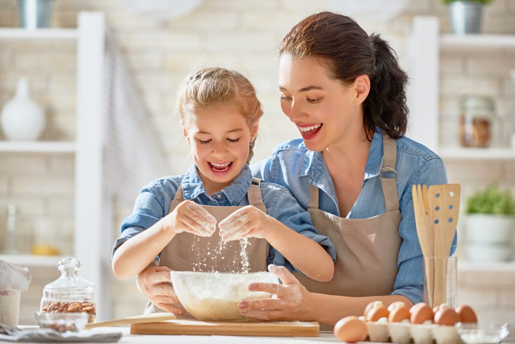 Mother and child baking together