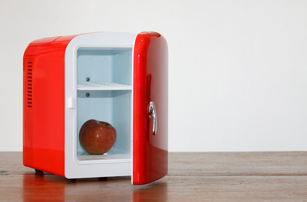 Shiny bright red miniature fridge