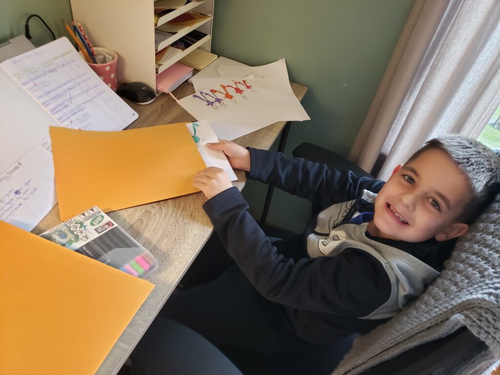 Ethan packaging his artwork, age 7