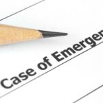 Close-up of Emergency document with pencil