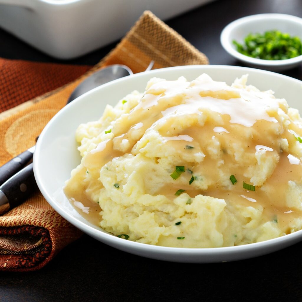 Mashed potatoes with gravy, traditional side dish for Thanksgiving
